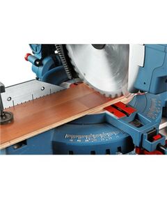 Электропилы: Торцовочная пила BOSCH GTM 12 JL 1800 Вт, 4300  об/мин, размер диска 305х30 мм, размер.раб.стола 465х308 мм, макс.ширина/макс.высота в гр. 151/95, высота заготовки в режиме настольной дисковой пилы 51 мм [0601B15001] фотографии