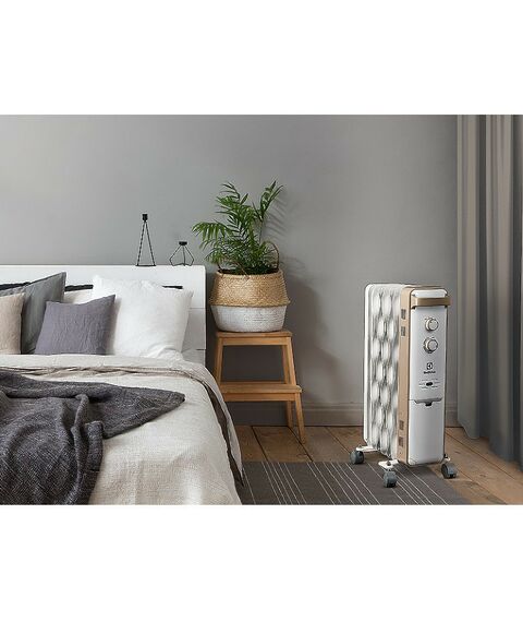 Масляные радиаторы: Масляный радиатор Electrolux Wave EOH/M-9157 мощность обогрева 1500 Вт, число секций: 7, термостат, колеса для перемещения, цвет белый фотографии